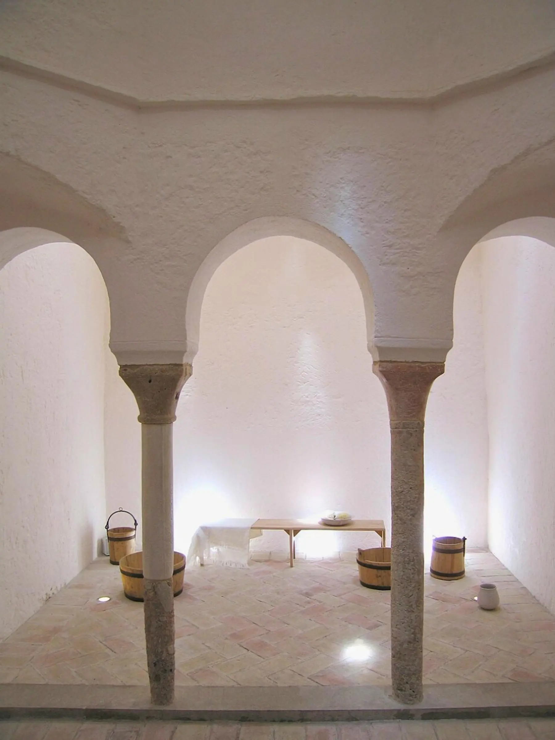 Baños del Almirante Interior Mudéjar horseshoe arches and stone columns inside the Baños del Almirante in Valencia
