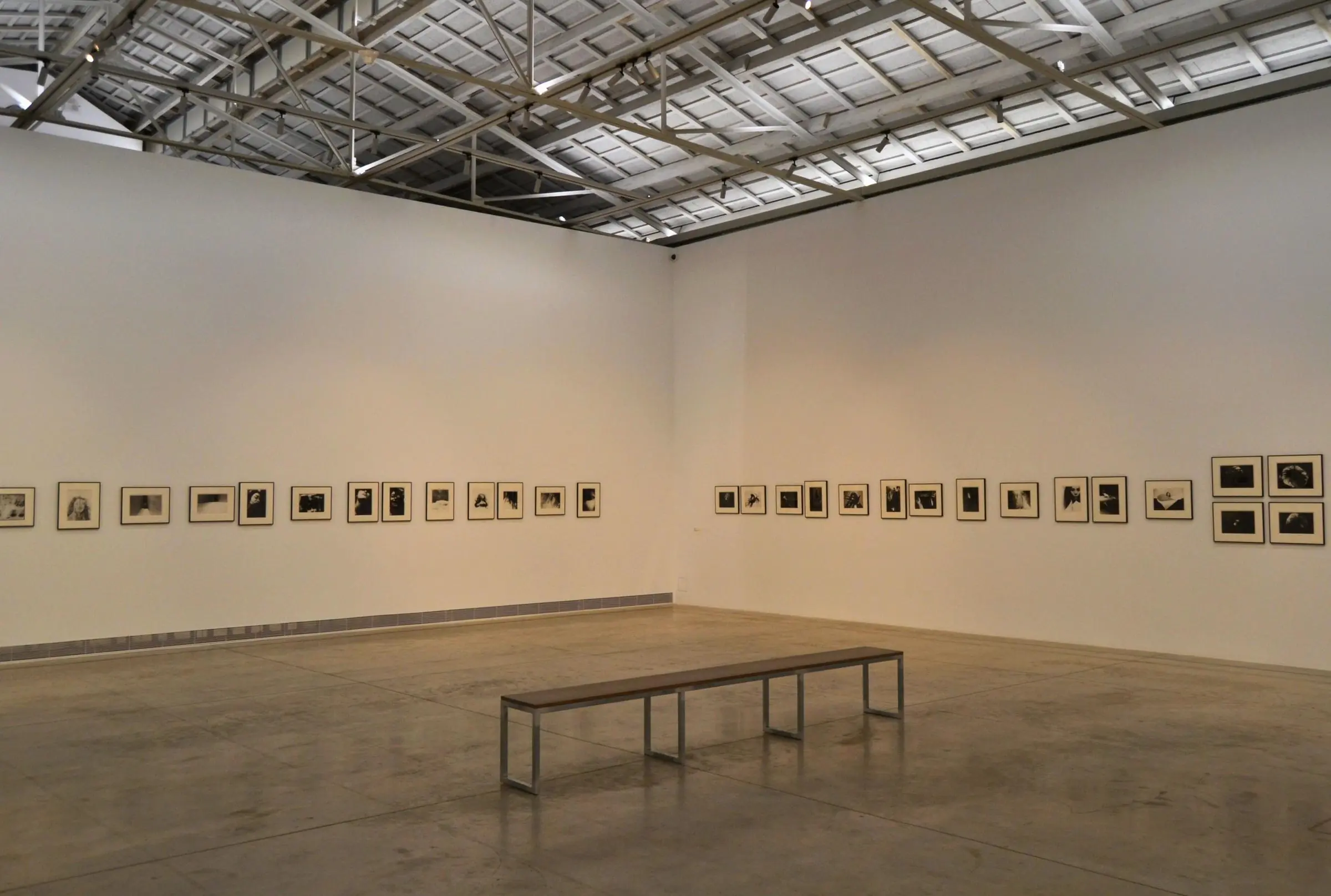 The massive, open-plan exhibition hall inside the former Bombas Gens factory with exposed industrial ceilings
