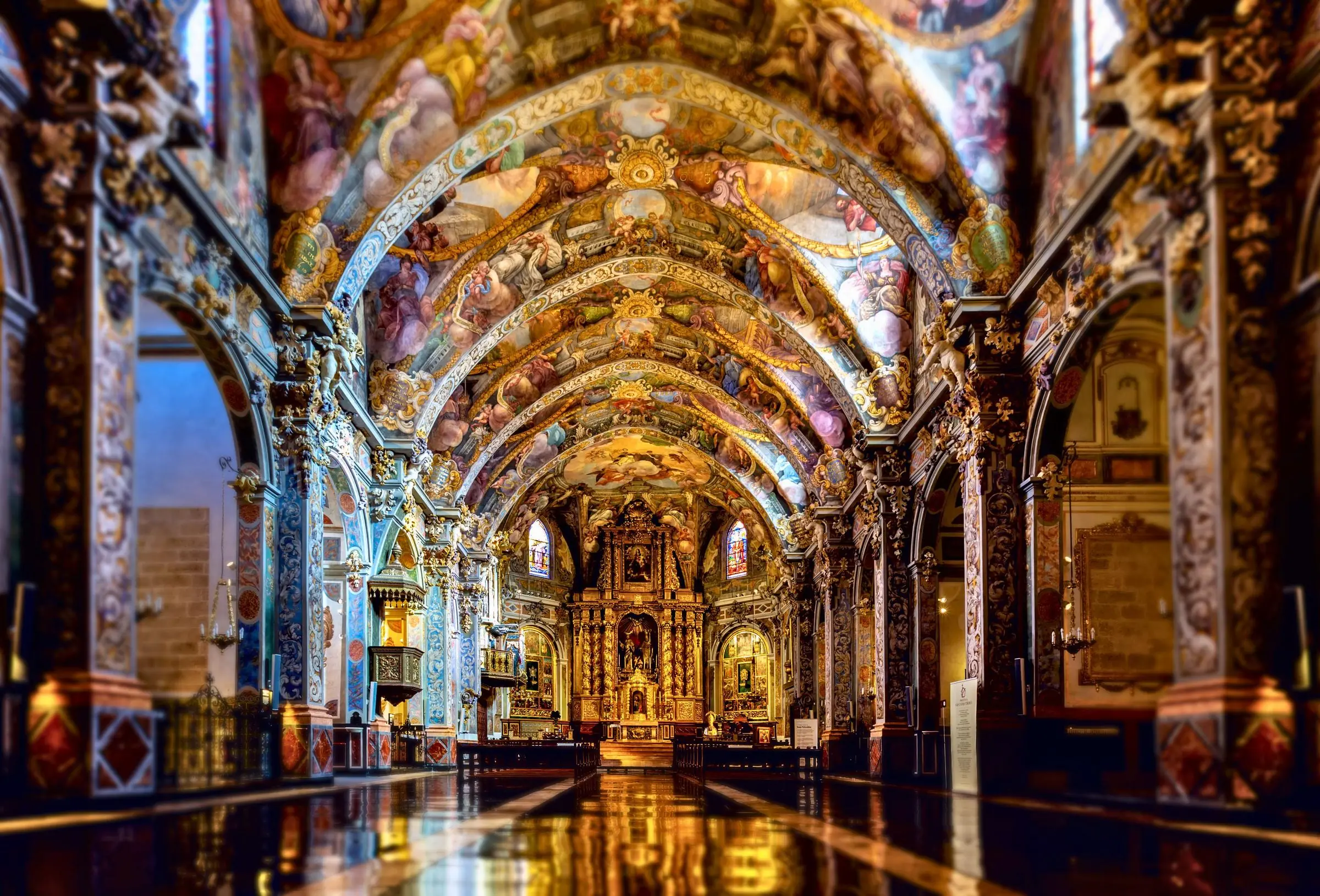 The elaborate Baroque ceiling frescoes of the Church of San Nicolás in Valencia