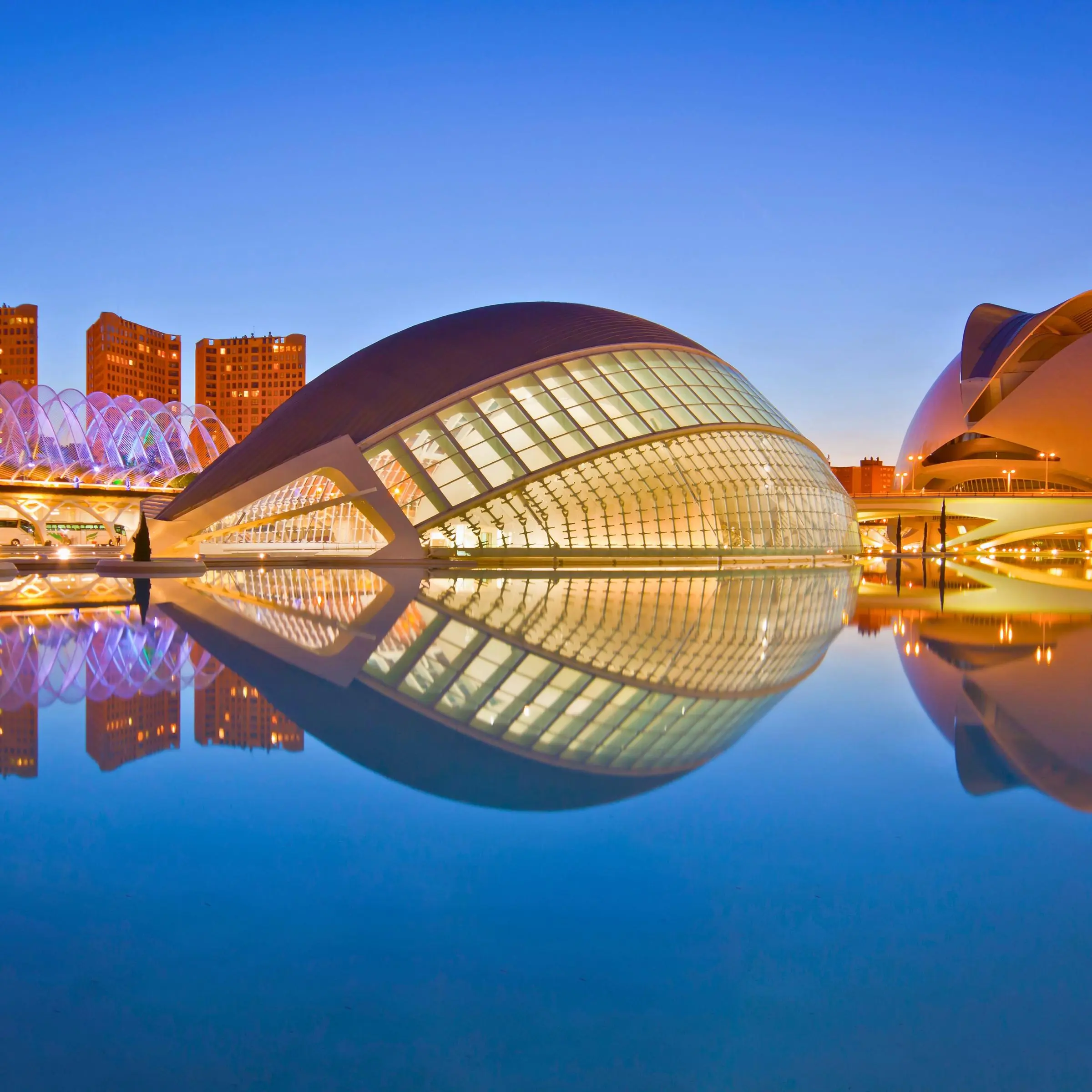 The Hemisferic eye reflecting in the pool at sunset