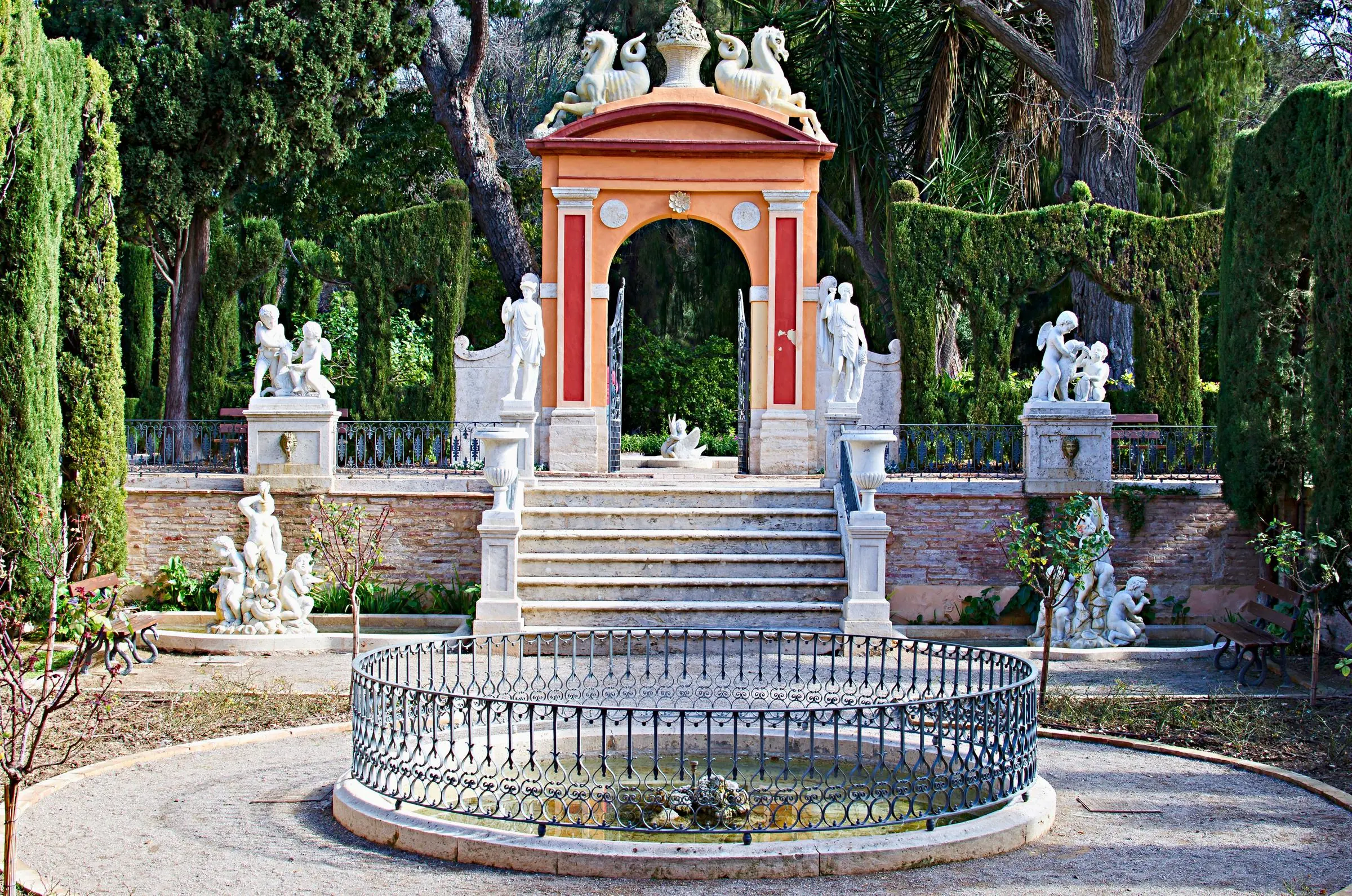The neoclassical pavilion and geometric hedges of Jardines de Monforte in Valencia