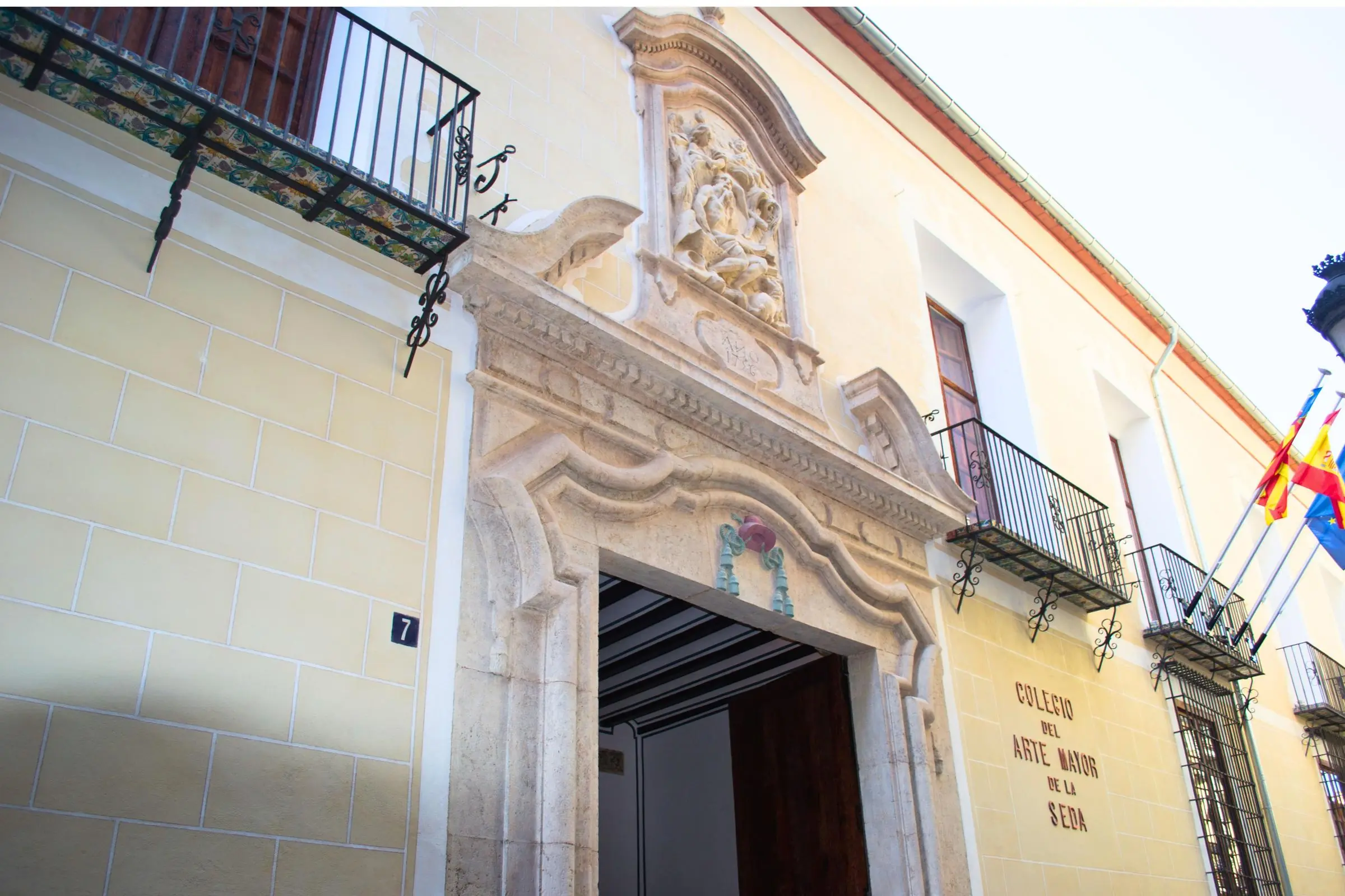 The historic facade and courtyard of the College of High Silk Art in Valencia